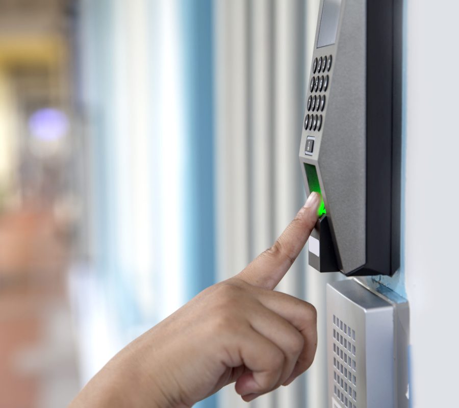 Close up hand of asian woman scanning fingerprint electronic digital door lock security system