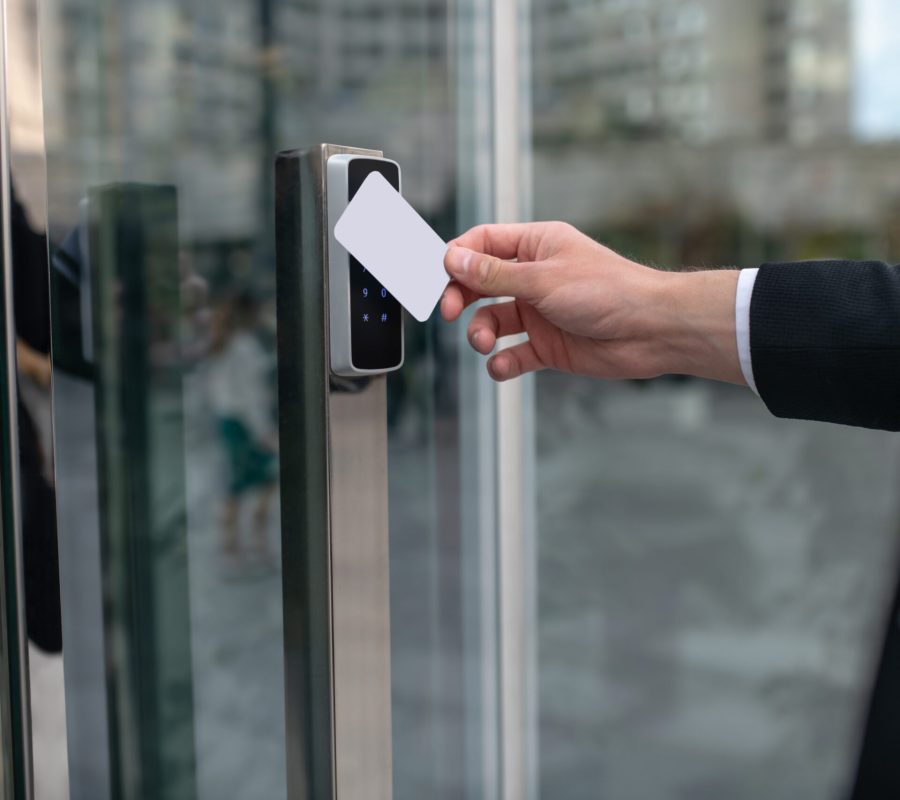 Pass card. Close up picture of mans hand holding a pass card